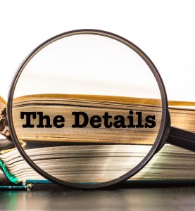 books and magnifying glass