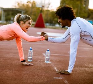 woman training with personal trainer outdoor